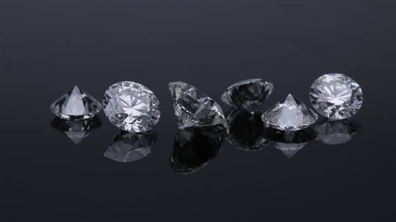 Faceted diamonds reflecting light, symbolizing clarity, trust, and authentic leadership